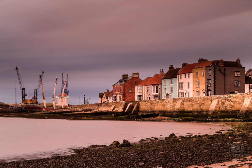 Hartlepool Harbour with a smoothed out pink and purple sky behind.